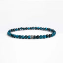 Light blue tigers eye small beaded bracelet with sterling silver bead