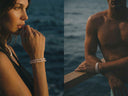 A man and woman wearing pearl jewellery, standing by the ocean.