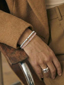 Close-up of a woman's hand wearing 4mm gemstone bracelets