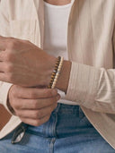 A man wearing bracelets in the 6mm bead size 