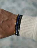Close-up of a wrist wearing our best selling bracelet stack
