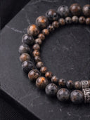 A close-up of two limited edition Emberlite beaded bracelets.
