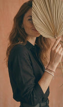 A woman modelling the latest earth-inspired jewellery collection