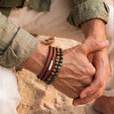 A man wearing a Chocolate Brown Leather  Bracelet at the beach
