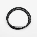 Black braided leather bracelet with silver clasp overhead view