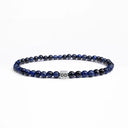 Blue tiger eye beaded bracelet with a brushed silver logo bead