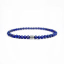 Lapis lazuli beaded bracelet with a brushed silver logo bead