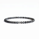Grey larvakite beaded bracelet with a brushed silver logo bead