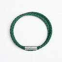 Green braided leather bracelet with silver clasp overhead view