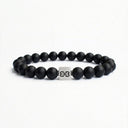 Matte black onyx beaded bracelet with a brushed silver logo bead