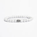 White howlite beaded bracelet with a brushed silver logo bead